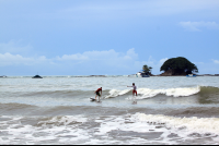        dominicalito waverider riding together 
  - Costa Rica